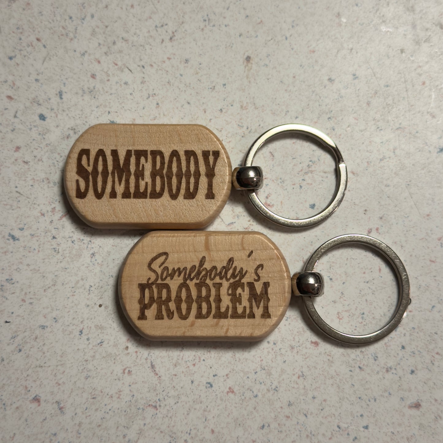 Somebody's Problem wood keychain set