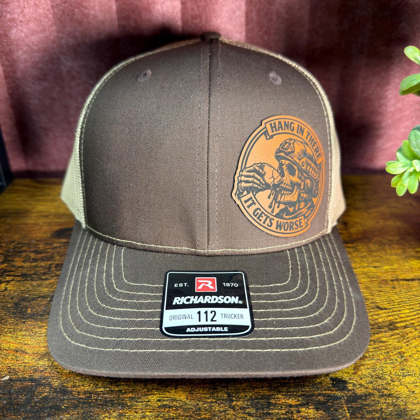 Hang In There, It Gets Worse Funny Skull Trucker Hat