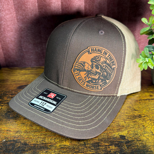 Hang In There, It Gets Worse Funny Skull Trucker Hat