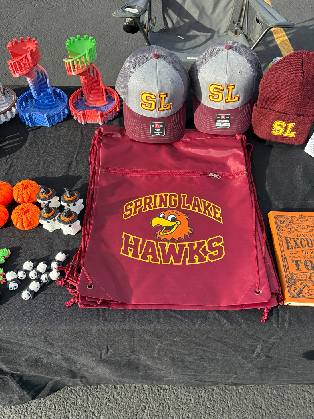 Spring Lake Hawks drawstring bag, embroidered hats and beanie at the fall festival